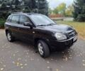 Черный Хендай Туксон, объемом двигателя 2 л и пробегом 280 тыс. км за 3250 $, фото 1 на Automoto.ua