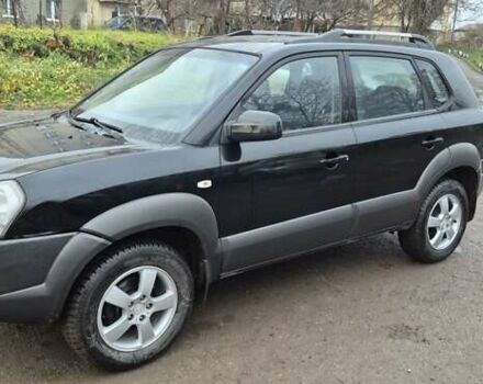 Черный Хендай Туксон, объемом двигателя 1.98 л и пробегом 230 тыс. км за 6390 $, фото 10 на Automoto.ua