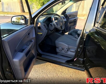 Черный Хендай Туксон, объемом двигателя 2 л и пробегом 253 тыс. км за 7600 $, фото 8 на Automoto.ua