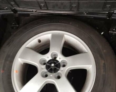 Черный Хендай Туксон, объемом двигателя 1.99 л и пробегом 250 тыс. км за 6650 $, фото 4 на Automoto.ua