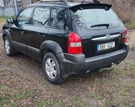 Черный Хендай Туксон, объемом двигателя 2 л и пробегом 284 тыс. км за 4700 $, фото 4 на Automoto.ua