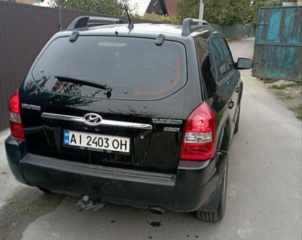 Черный Хендай Туксон, объемом двигателя 2 л и пробегом 261 тыс. км за 7500 $, фото 2 на Automoto.ua