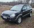 Черный Хендай Туксон, объемом двигателя 2 л и пробегом 284 тыс. км за 4700 $, фото 2 на Automoto.ua