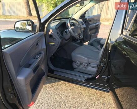 Черный Хендай Туксон, объемом двигателя 2 л и пробегом 253 тыс. км за 7500 $, фото 2 на Automoto.ua