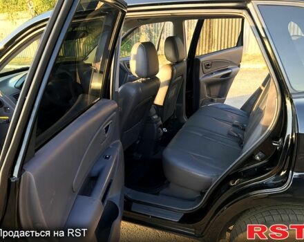Черный Хендай Туксон, объемом двигателя 2 л и пробегом 253 тыс. км за 7600 $, фото 7 на Automoto.ua