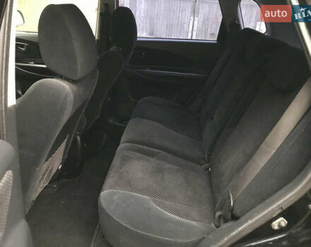 Черный Хендай Туксон, объемом двигателя 2 л и пробегом 261 тыс. км за 6500 $, фото 12 на Automoto.ua