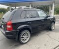 Черный Хендай Туксон, объемом двигателя 2 л и пробегом 230 тыс. км за 7500 $, фото 2 на Automoto.ua