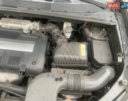 Черный Хендай Туксон, объемом двигателя 2 л и пробегом 190 тыс. км за 7500 $, фото 18 на Automoto.ua