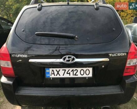 Черный Хендай Туксон, объемом двигателя 2 л и пробегом 253 тыс. км за 7500 $, фото 1 на Automoto.ua