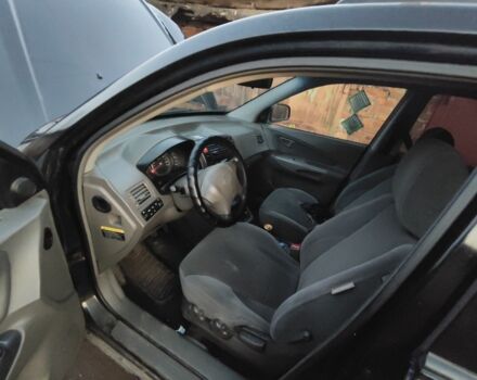 Черный Хендай Туксон, объемом двигателя 2 л и пробегом 370 тыс. км за 3300 $, фото 4 на Automoto.ua