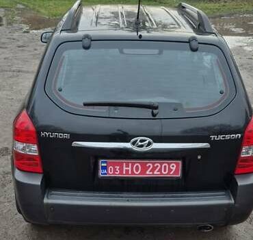 Черный Хендай Туксон, объемом двигателя 1.98 л и пробегом 230 тыс. км за 6390 $, фото 7 на Automoto.ua