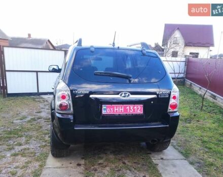 Черный Хендай Туксон, объемом двигателя 2 л и пробегом 208 тыс. км за 6950 $, фото 44 на Automoto.ua