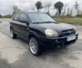 Черный Хендай Туксон, объемом двигателя 2 л и пробегом 230 тыс. км за 7500 $, фото 4 на Automoto.ua