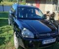 Черный Хендай Туксон, объемом двигателя 2 л и пробегом 176 тыс. км за 7300 $, фото 1 на Automoto.ua