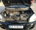 Черный Хендай Туксон, объемом двигателя 1.98 л и пробегом 252 тыс. км за 8150 $, фото 3 на Automoto.ua