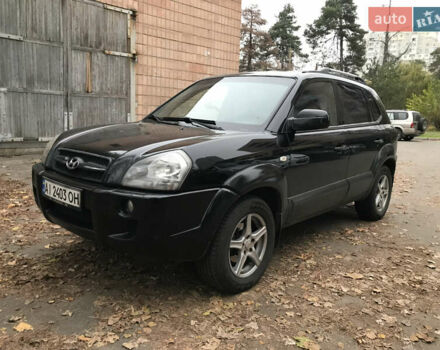 Черный Хендай Туксон, объемом двигателя 2 л и пробегом 261 тыс. км за 6500 $, фото 1 на Automoto.ua