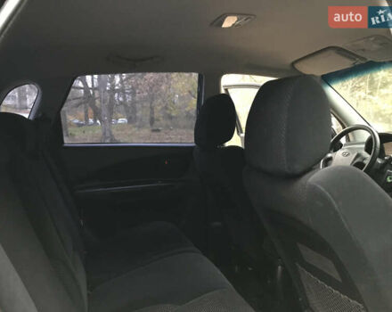 Черный Хендай Туксон, объемом двигателя 2 л и пробегом 261 тыс. км за 6500 $, фото 22 на Automoto.ua