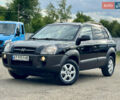 Черный Хендай Туксон, объемом двигателя 2 л и пробегом 225 тыс. км за 7900 $, фото 1 на Automoto.ua