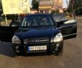 Черный Хендай Туксон, объемом двигателя 2 л и пробегом 253 тыс. км за 7600 $, фото 2 на Automoto.ua