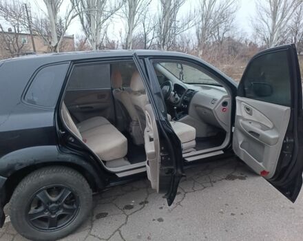 Черный Хендай Туксон, объемом двигателя 2 л и пробегом 293 тыс. км за 4300 $, фото 4 на Automoto.ua