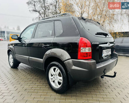 Черный Хендай Туксон, объемом двигателя 1.98 л и пробегом 252 тыс. км за 7300 $, фото 6 на Automoto.ua