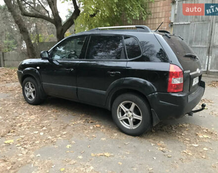 Черный Хендай Туксон, объемом двигателя 2 л и пробегом 261 тыс. км за 6500 $, фото 9 на Automoto.ua