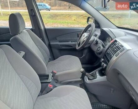 Черный Хендай Туксон, объемом двигателя 1.98 л и пробегом 192 тыс. км за 6900 $, фото 19 на Automoto.ua