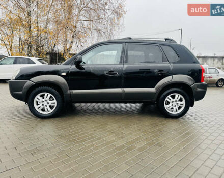 Черный Хендай Туксон, объемом двигателя 1.98 л и пробегом 252 тыс. км за 7300 $, фото 7 на Automoto.ua
