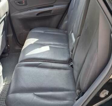 Черный Хендай Туксон, объемом двигателя 1.98 л и пробегом 193 тыс. км за 8000 $, фото 7 на Automoto.ua