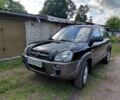 Черный Хендай Туксон, объемом двигателя 2 л и пробегом 238 тыс. км за 8200 $, фото 1 на Automoto.ua