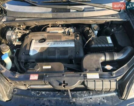 Черный Хендай Туксон, объемом двигателя 2 л и пробегом 253 тыс. км за 7500 $, фото 4 на Automoto.ua