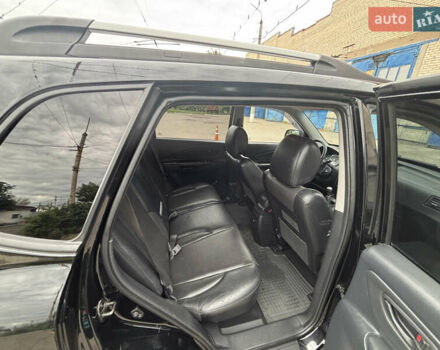 Черный Хендай Туксон, объемом двигателя 1.98 л и пробегом 215 тыс. км за 8600 $, фото 11 на Automoto.ua