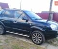 Черный Хендай Туксон, объемом двигателя 2 л и пробегом 208 тыс. км за 6950 $, фото 4 на Automoto.ua