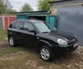 Черный Хендай Туксон, объемом двигателя 2 л и пробегом 137 тыс. км за 7499 $, фото 1 на Automoto.ua