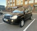 Черный Хендай Туксон, объемом двигателя 2 л и пробегом 180 тыс. км за 4400 $, фото 1 на Automoto.ua