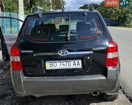 Черный Хендай Туксон, объемом двигателя 1.98 л и пробегом 193 тыс. км за 8000 $, фото 2 на Automoto.ua