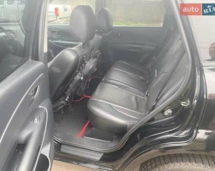 Черный Хендай Туксон, объемом двигателя 2 л и пробегом 190 тыс. км за 7500 $, фото 7 на Automoto.ua