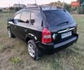 Черный Хендай Туксон, объемом двигателя 1.98 л и пробегом 160 тыс. км за 6150 $, фото 1 на Automoto.ua