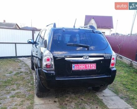Черный Хендай Туксон, объемом двигателя 2 л и пробегом 208 тыс. км за 6950 $, фото 43 на Automoto.ua