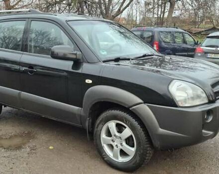 Черный Хендай Туксон, объемом двигателя 1.98 л и пробегом 230 тыс. км за 6390 $, фото 4 на Automoto.ua