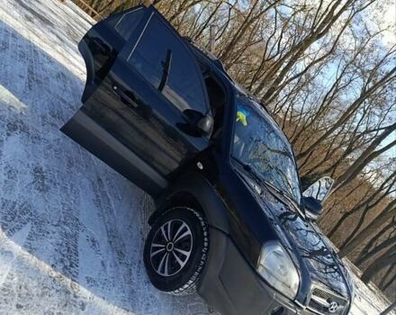 Черный Хендай Туксон, объемом двигателя 1.98 л и пробегом 285 тыс. км за 5600 $, фото 11 на Automoto.ua