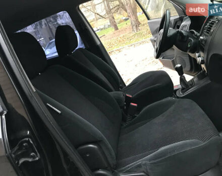 Черный Хендай Туксон, объемом двигателя 2 л и пробегом 261 тыс. км за 6500 $, фото 23 на Automoto.ua