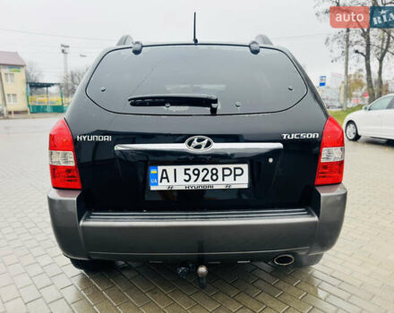 Черный Хендай Туксон, объемом двигателя 1.98 л и пробегом 252 тыс. км за 7300 $, фото 5 на Automoto.ua