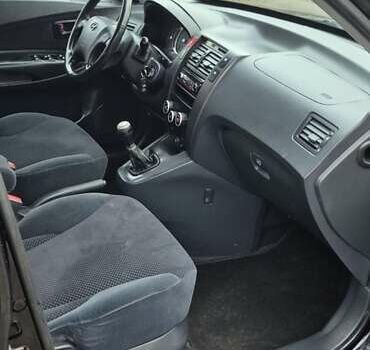 Черный Хендай Туксон, объемом двигателя 1.98 л и пробегом 230 тыс. км за 6390 $, фото 21 на Automoto.ua