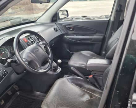 Черный Хендай Туксон, объемом двигателя 2 л и пробегом 170 тыс. км за 6999 $, фото 7 на Automoto.ua