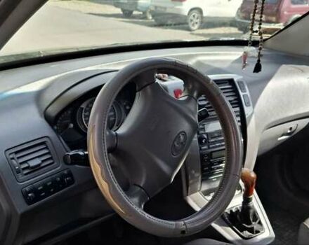 Черный Хендай Туксон, объемом двигателя 1.98 л и пробегом 193 тыс. км за 8000 $, фото 4 на Automoto.ua