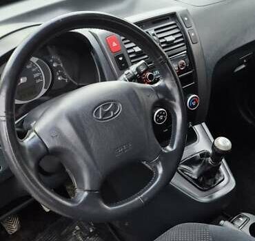 Черный Хендай Туксон, объемом двигателя 1.98 л и пробегом 230 тыс. км за 6390 $, фото 20 на Automoto.ua