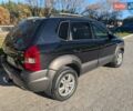 Черный Хендай Туксон, объемом двигателя 1.98 л и пробегом 226 тыс. км за 6500 $, фото 8 на Automoto.ua