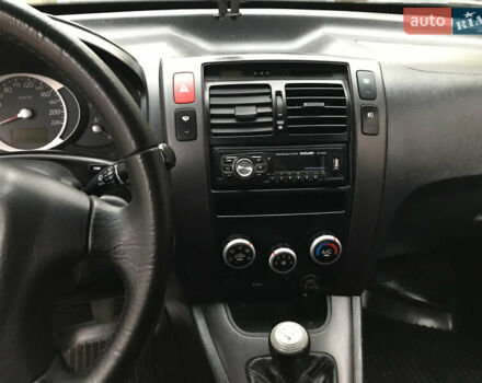 Черный Хендай Туксон, объемом двигателя 2 л и пробегом 261 тыс. км за 6500 $, фото 15 на Automoto.ua