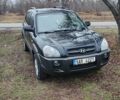 Черный Хендай Туксон, объемом двигателя 2 л и пробегом 284 тыс. км за 4700 $, фото 1 на Automoto.ua